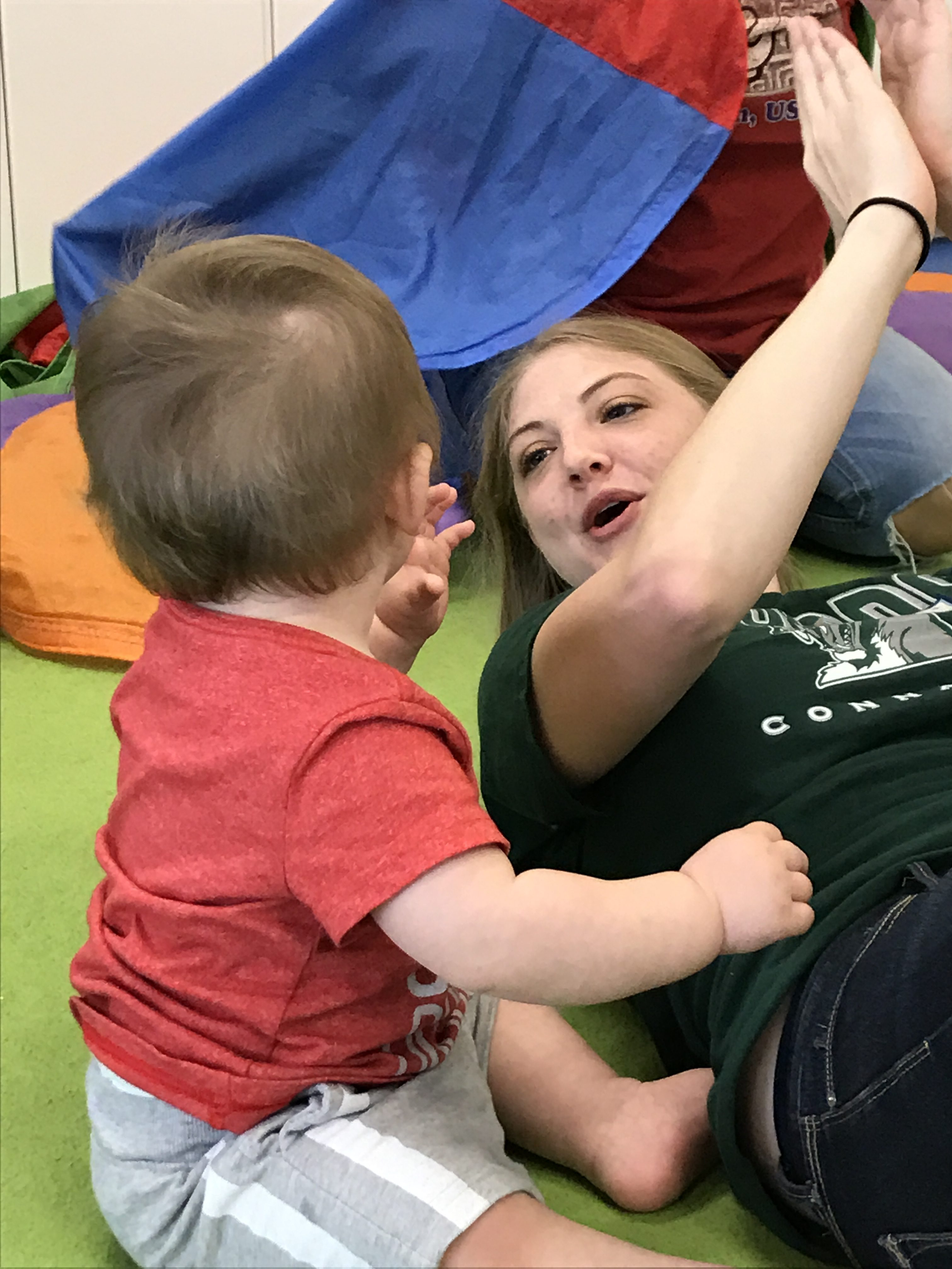 IMG_2028 Under the parachute, in love with his favorite teacher!