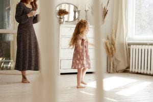 A mother and daughter walking around their new safe home