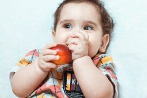 sourena , cute brown boy , little kid eating peach