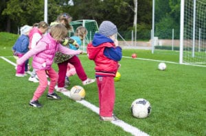 Toddler playing soccer