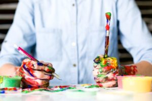 A boy painting and drawing.