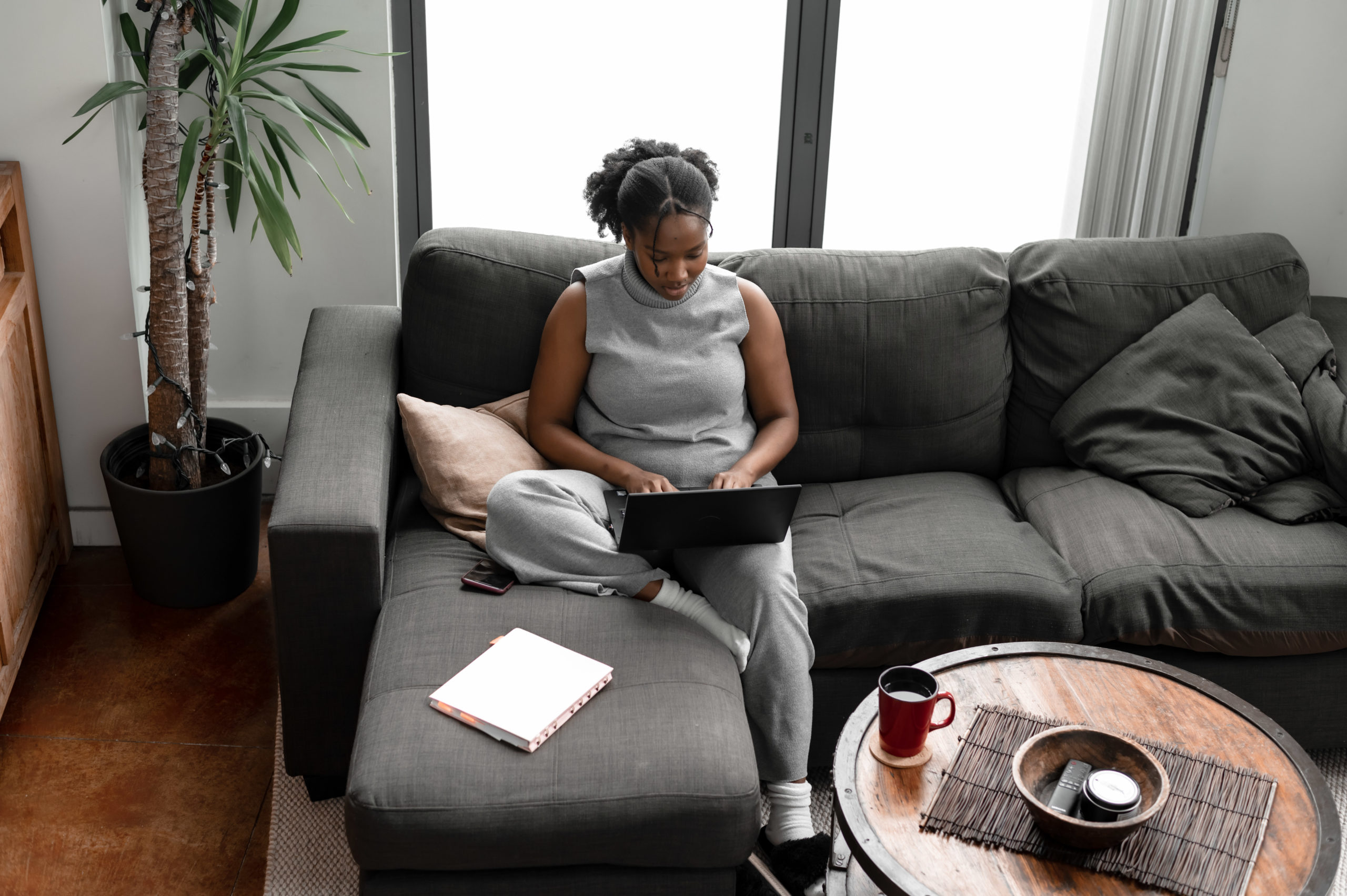 A woman typing on her laptop