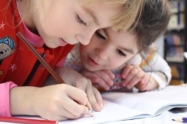 Two children doing their homework.
