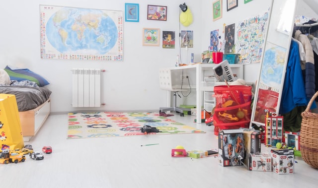 A cluttered room as an example of how not to set up a productive study space for a child