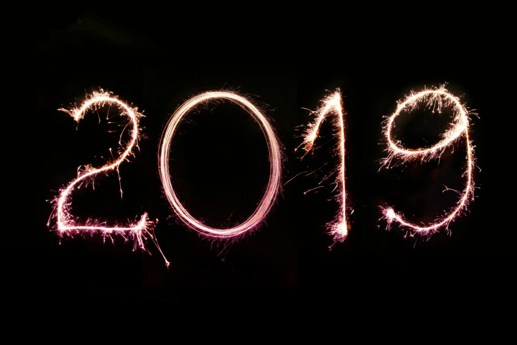 Long exposure photo of the 2019 numbers created with sparklers on a pitch-black background. Perfect for 2019 greeting cards and newsletter e-mails, personal and business social media & blog posts. More shots like this > https://www.shutterstock.com/g/pink+broccoli Follow us on Instagram > https://www.instagram.com/nordwood For fierce WordPress bloggers > https://themeforest.net/user/nordwood/portfolio